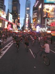 Cyclists in Critical Mass ride through Times Square in New York City on July 30, 2004