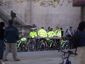 Metropolitan Police officers with their cycles awaiting the start of Critical Mass London, April 2006.