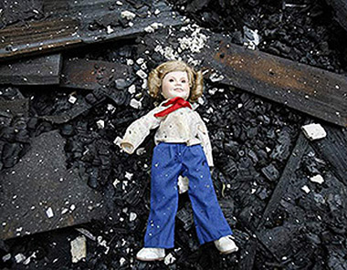 REAL FIREPROOF DOLL... OR PLACED AFTER FIRE?
